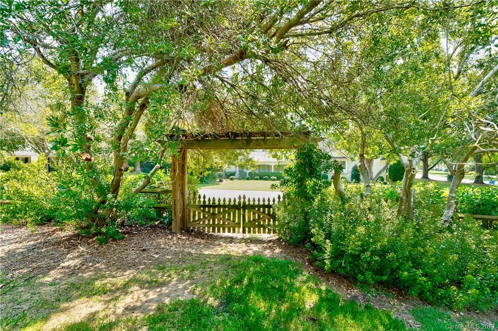 3200 Wickersham Road Charlotte, NC 28211 - Photo 33 of 40 a view of a gate with a tree