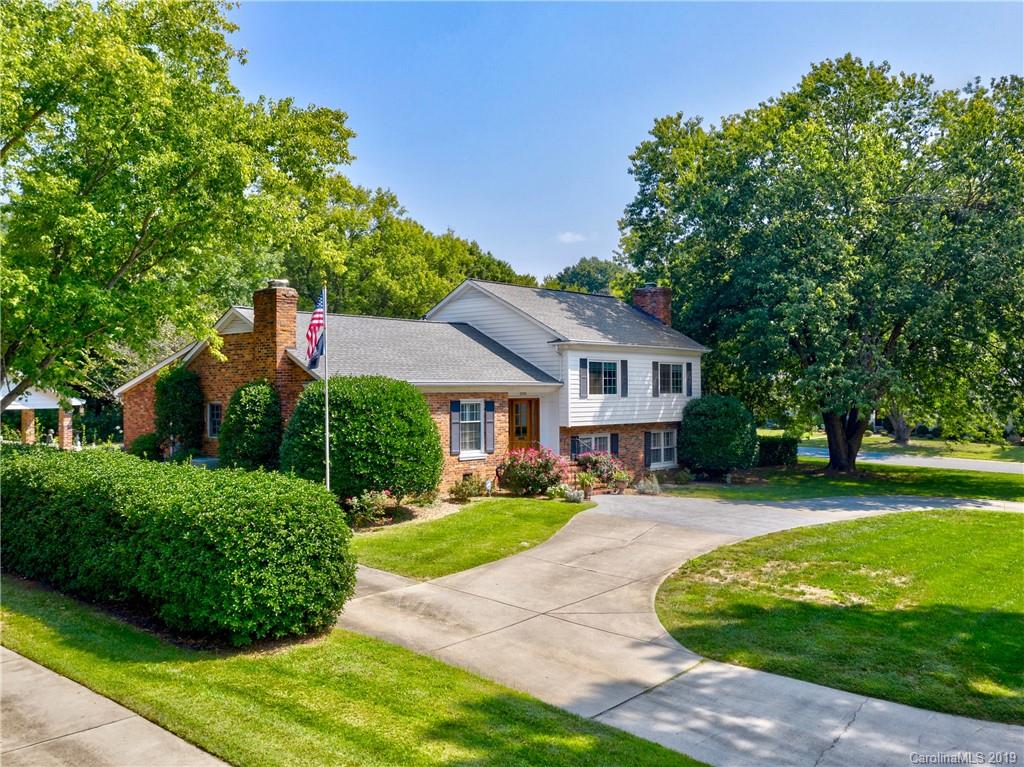 3200 Wickersham Road Charlotte, NC 28211 - Photo 34 of 40 a front view of a house with a yard table and chairs