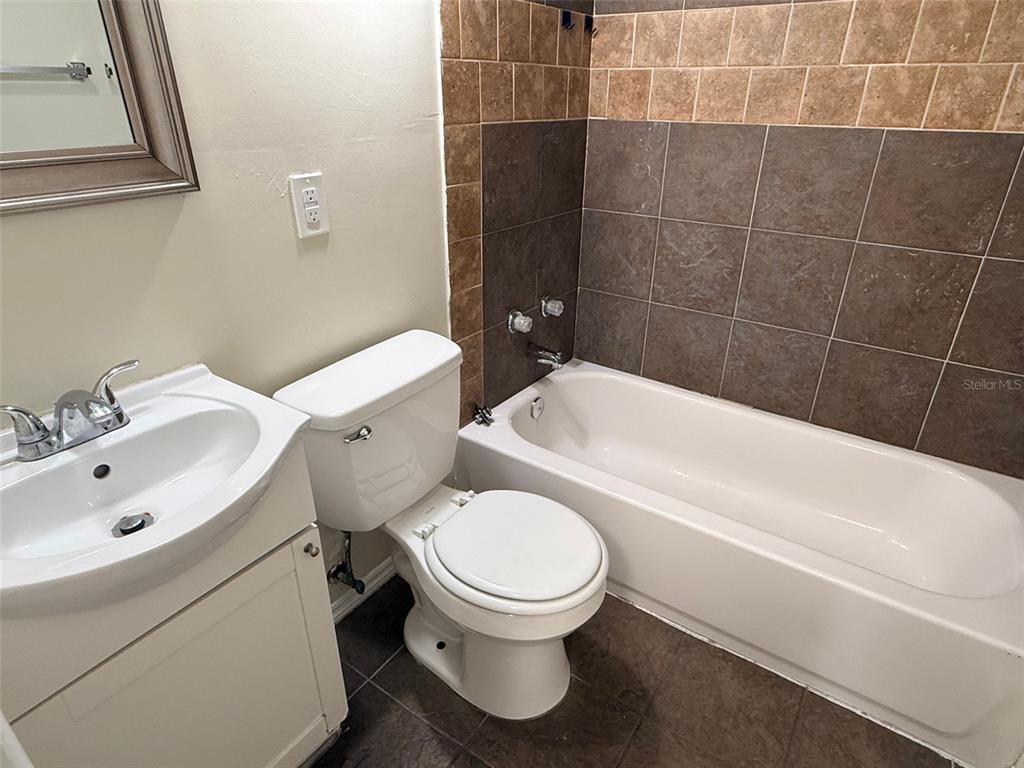 3704 36th Street West Bradenton, FL 34205 - Photo 18 of 34 a bathroom with a sink a toilet and bathtub