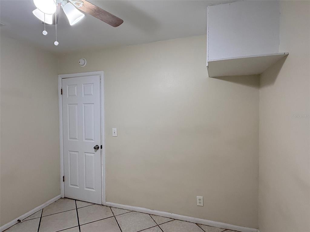 3704 36th Street West Bradenton, FL 34205 - Photo 27 of 34 a view of an empty room with a chandelier fan