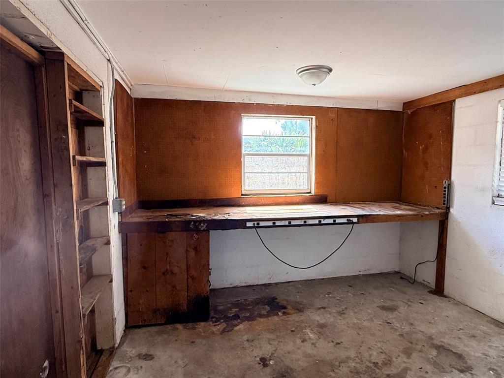 3704 36th Street West Bradenton, FL 34205 - Photo 32 of 34 a room with a chair and a window