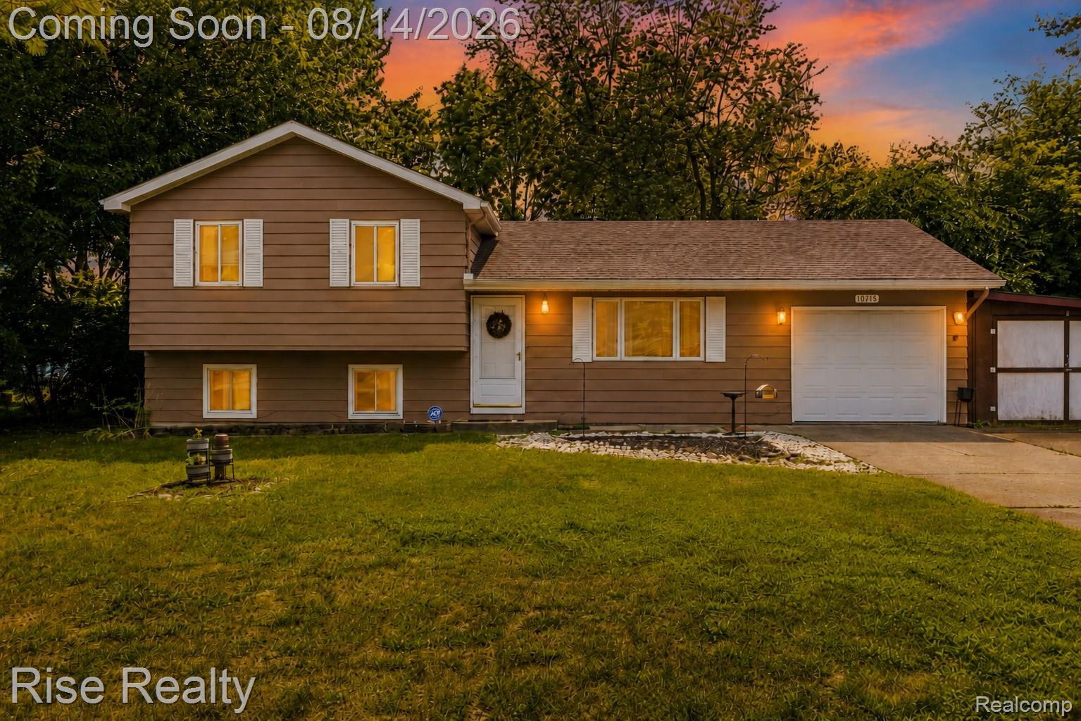 10215 West Frances Road Flushing, MI 48433 - Photo 1 of 31 Brown siding exterior with white window shutters