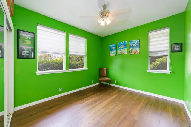 a room with green walls and a window