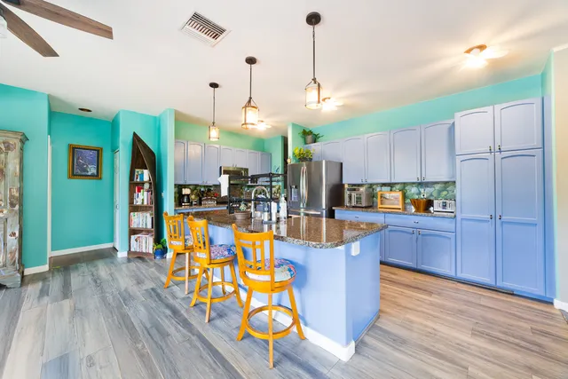 a view of a kitchen and dining area