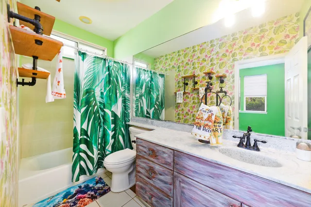 a bathroom with a sink a mirror and a toilet