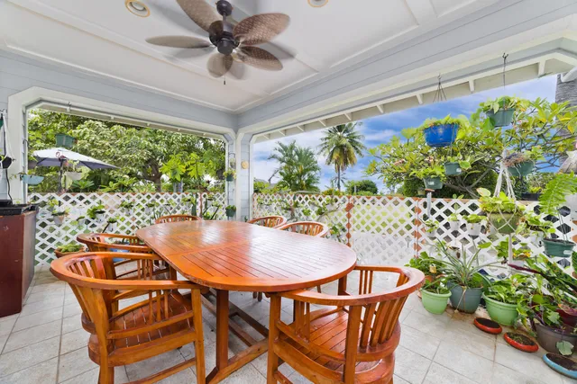 a outdoor dining space with furniture and garden view