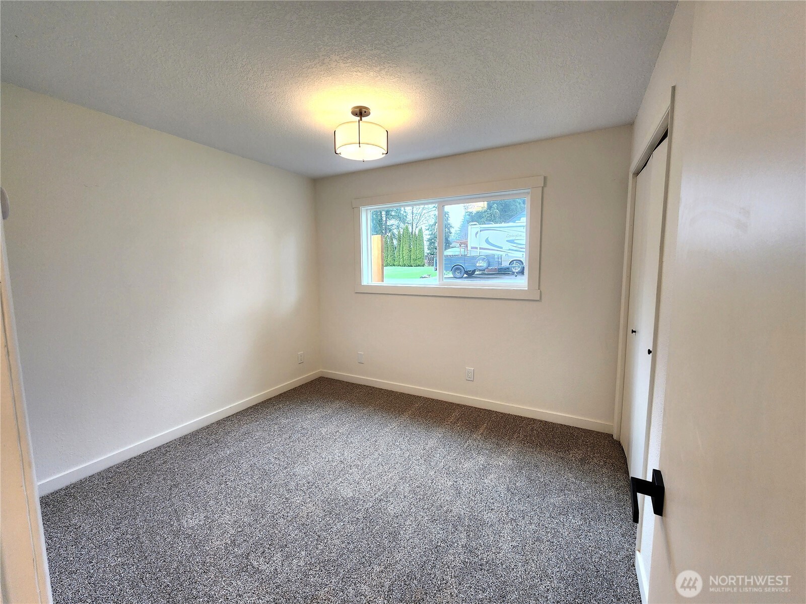 103 Kraft Road Longview, WA 98632 - Photo 13 of 19 an empty room with windows and closet