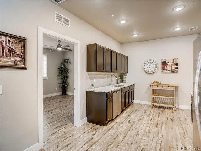 a kitchen with stainless steel appliances a refrigerator and a stove
