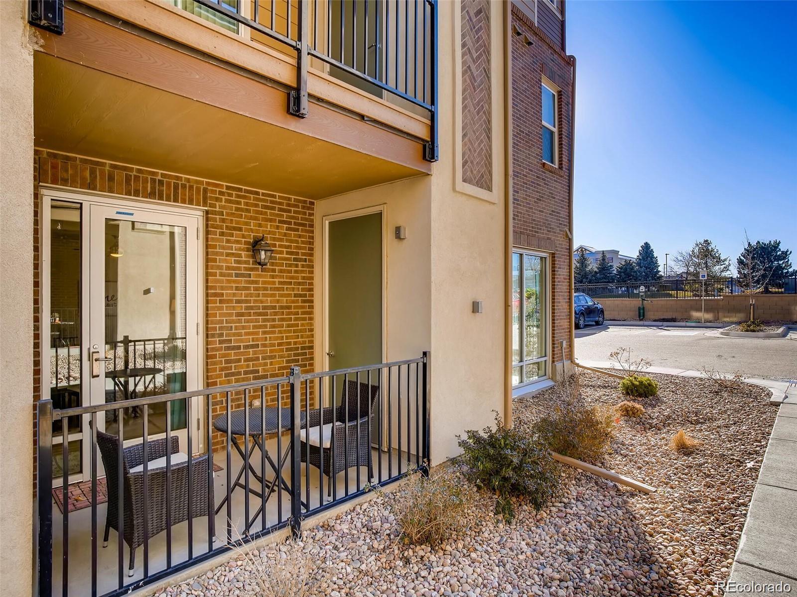 15274 West 64th Lane, Unit 107 Arvada, CO 80007 - Photo 17 of 24 a view of a pathway of a building