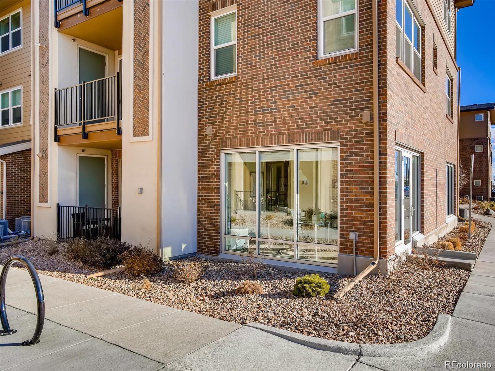 15274 West 64th Lane, Unit 107 Arvada, CO 80007 - Photo 23 of 24 a front view of a house