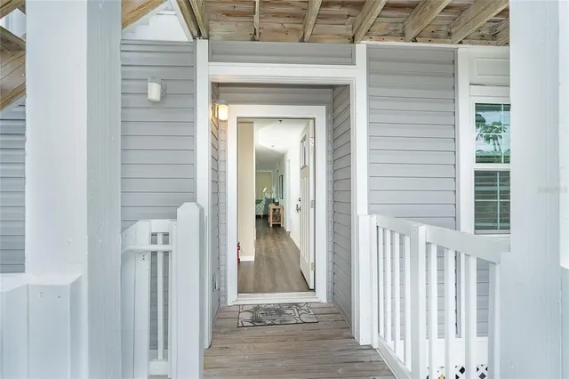 a view of a wooden door with a glass door