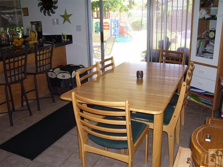 68325 Encinitas Road Cathedral City, CA 92234 - Photo 14 of 20 a dining room with furniture and wooden floor