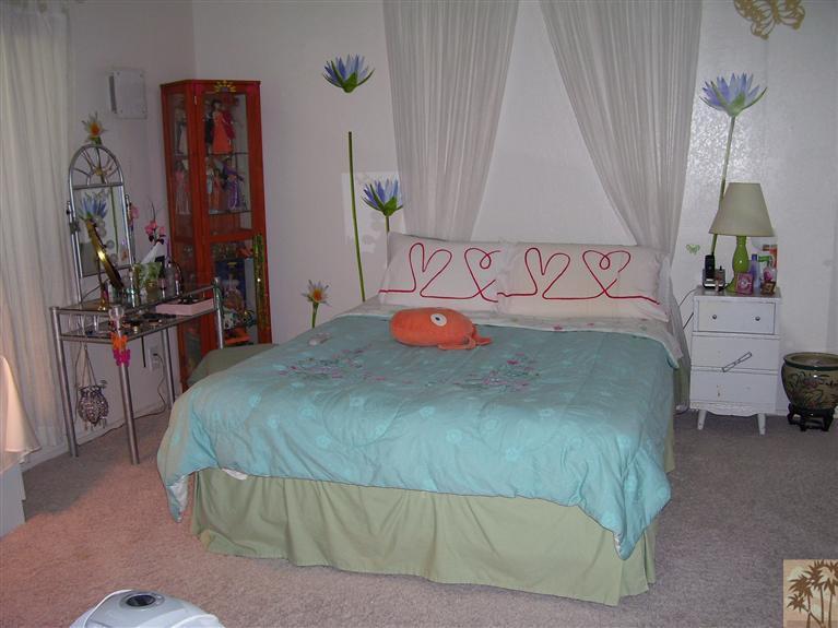 68325 Encinitas Road Cathedral City, CA 92234 - Photo 16 of 20 a bedroom with a bed and dresser