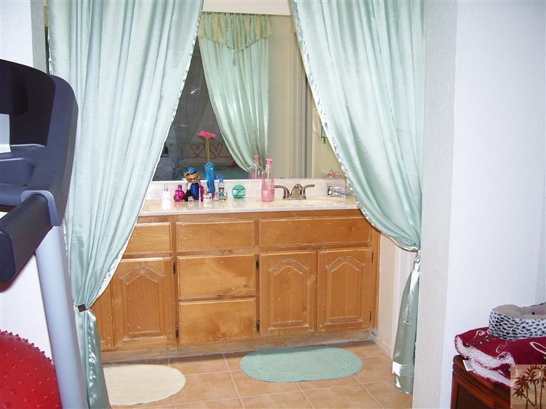 68325 Encinitas Road Cathedral City, CA 92234 - Photo 17 of 20 a bathroom with a sink toilet and shower