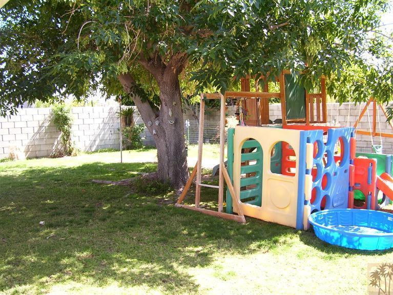 68325 Encinitas Road Cathedral City, CA 92234 - Photo 18 of 20 a backyard of a house with lots of green space