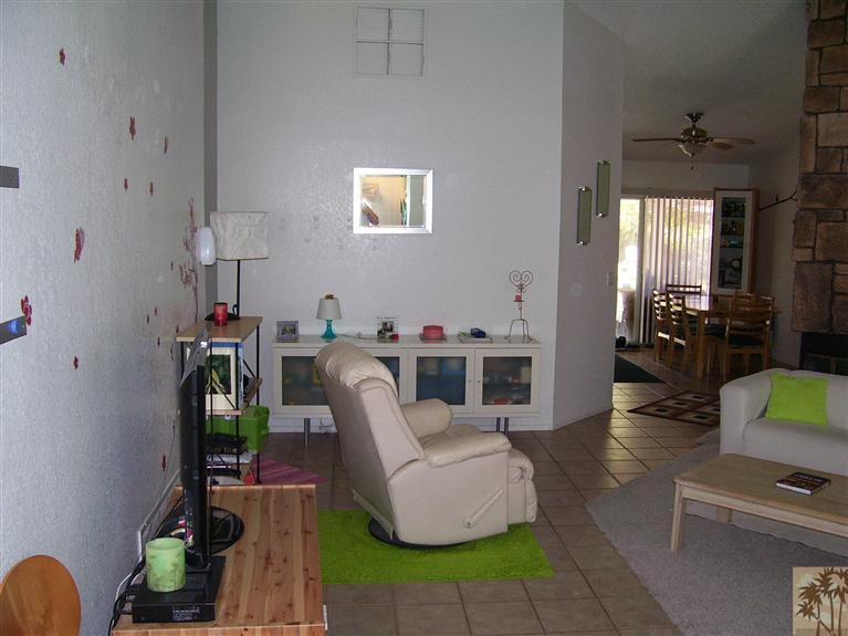 68325 Encinitas Road Cathedral City, CA 92234 - Photo 4 of 20 a living room with furniture and a flat screen tv