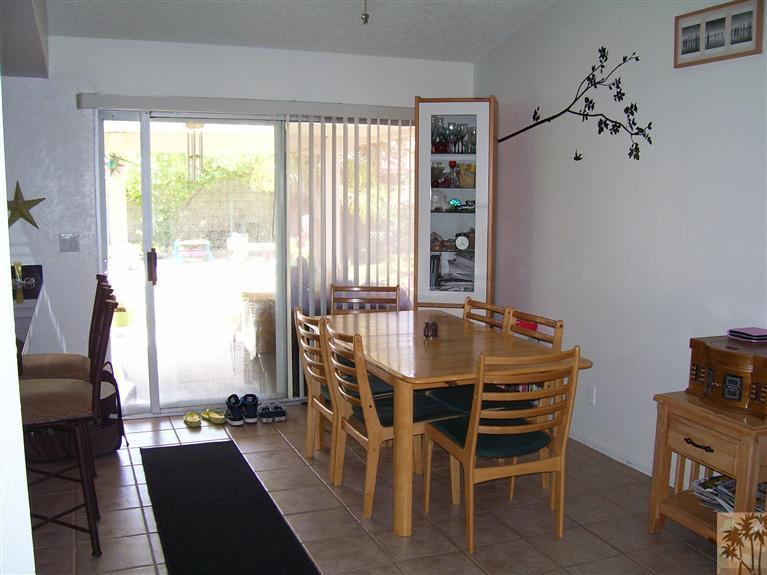 68325 Encinitas Road Cathedral City, CA 92234 - Photo 5 of 20 a dining room with furniture and a window