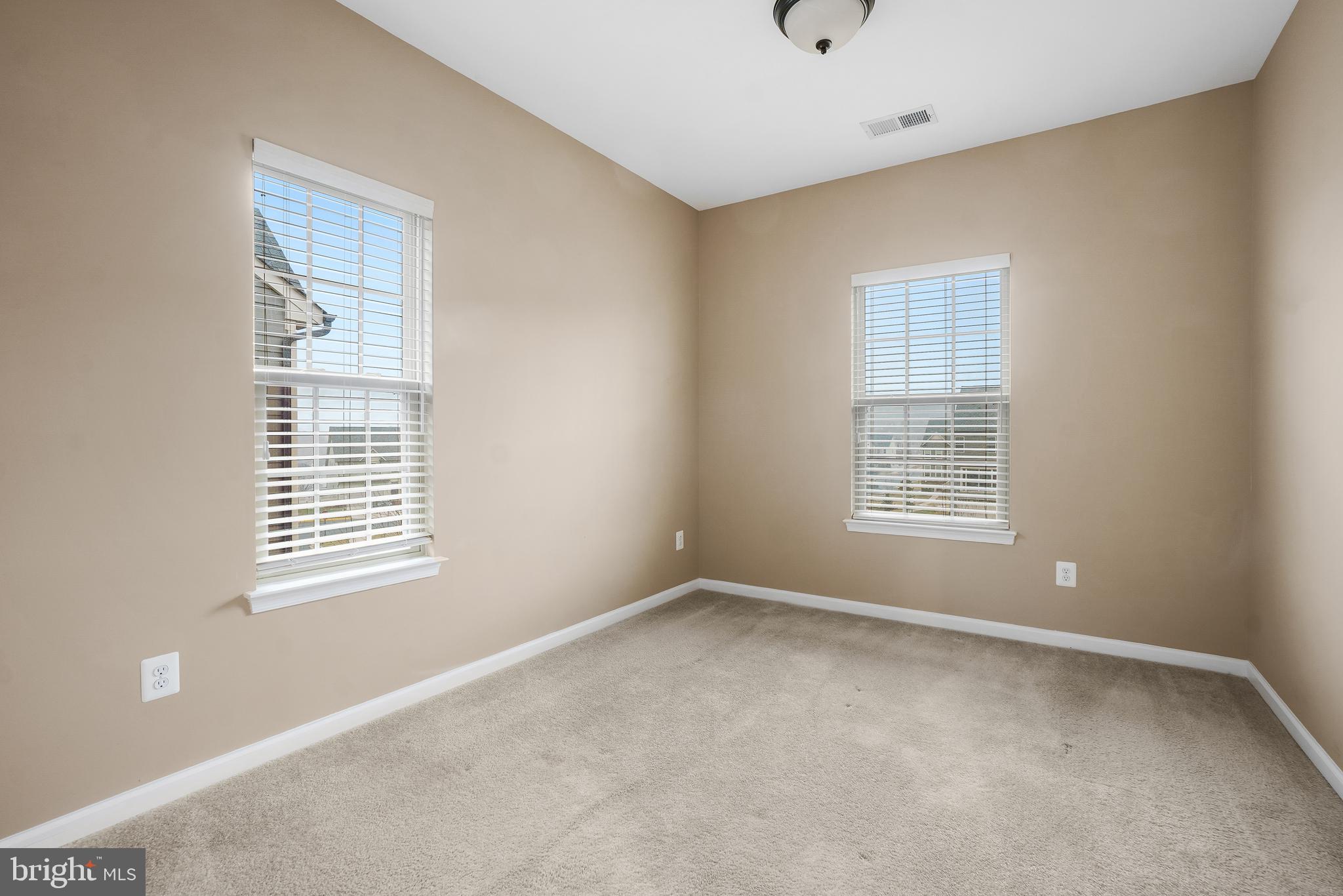 2011 Serviceberry Road Dumfries, VA 22026 - Photo 17 of 25 a view of an empty room with a window