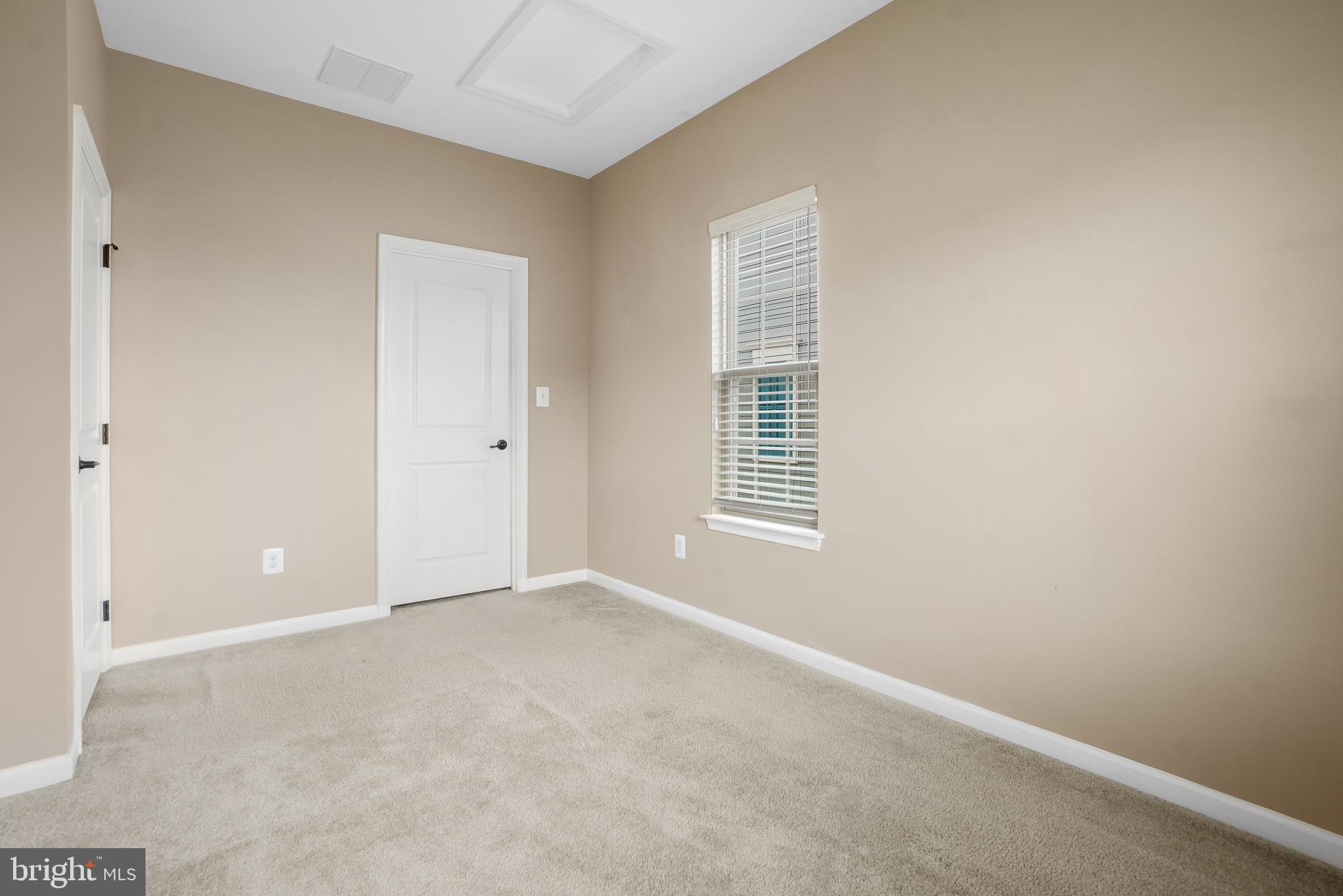 2011 Serviceberry Road Dumfries, VA 22026 - Photo 18 of 25 a view of an empty room with a window