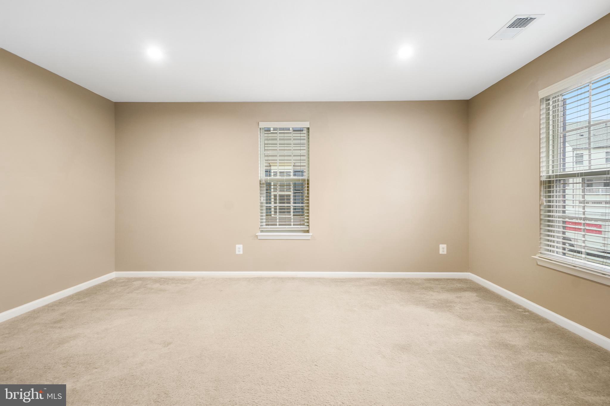 2011 Serviceberry Road Dumfries, VA 22026 - Photo 23 of 25 an empty room with windows