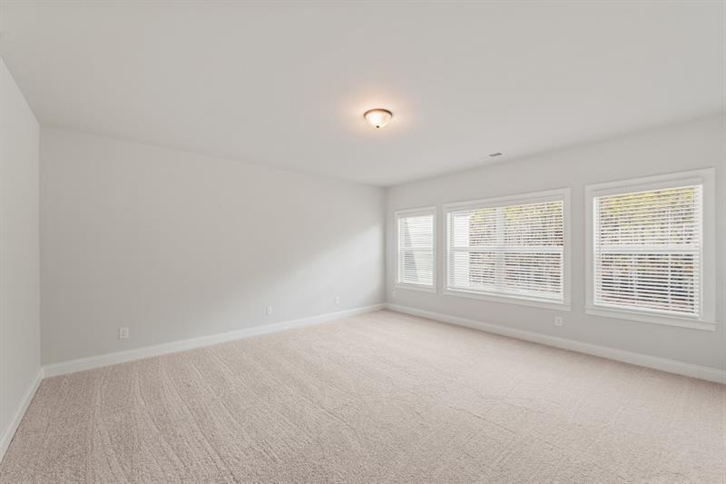 3264 Lions Ruby Lane Atlanta, GA 30349 - Photo 12 of 29 an empty room with a empty space and windows