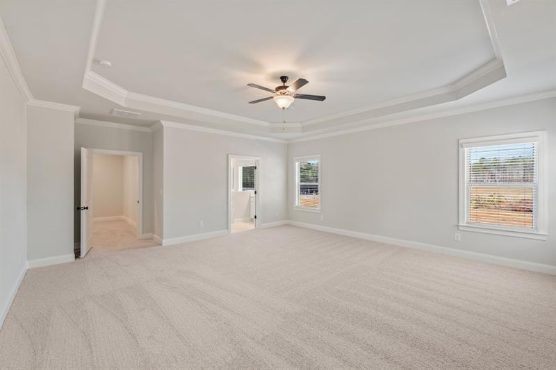 3264 Lions Ruby Lane Atlanta, GA 30349 - Photo 18 of 29 a view of a big room with chandelier fan and windows