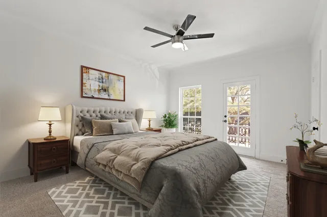 a bedroom with a large bed and a window