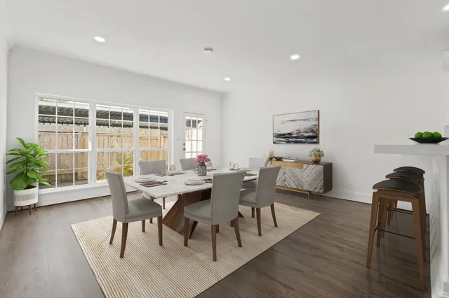 a dining room with furniture and wooden floor