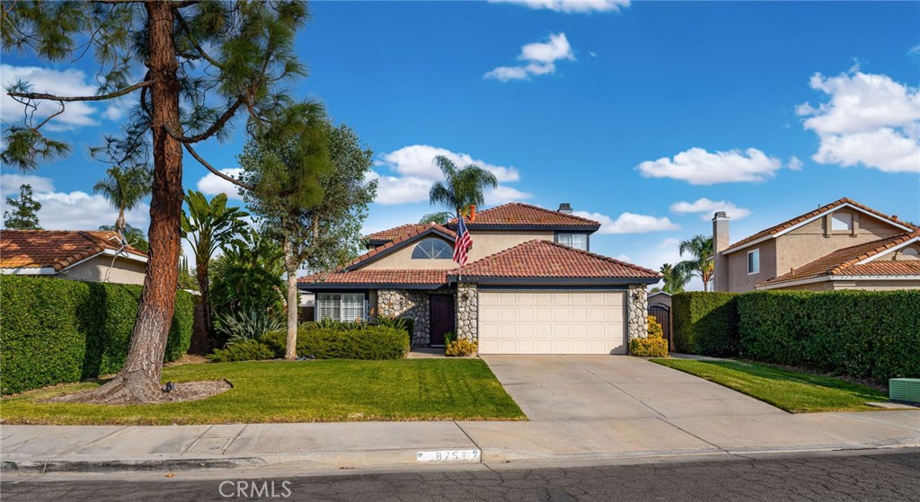 8754 Belladona Road Riverside, CA 92508 - Photo 1 of 1 a front view of a house with garden