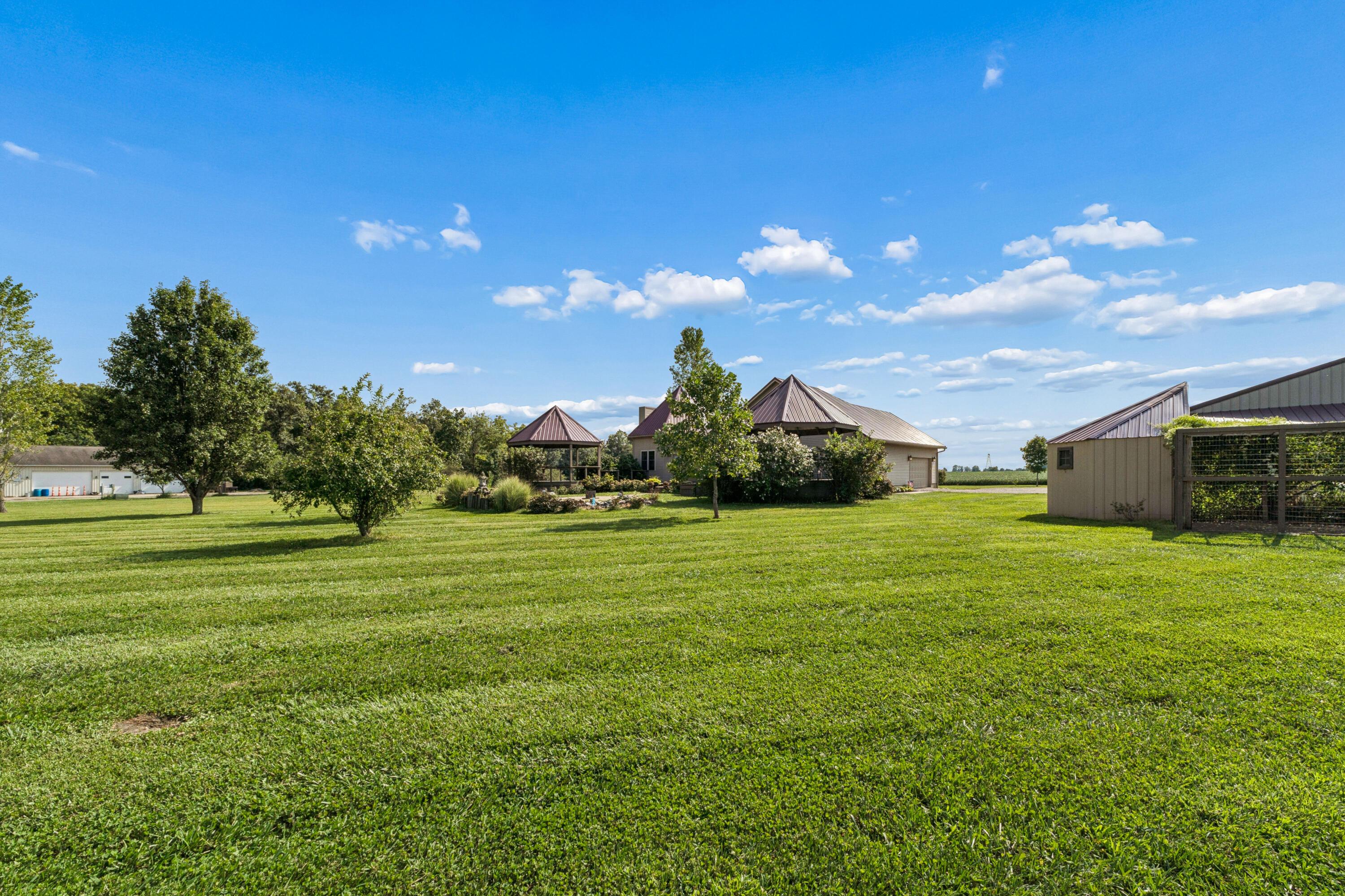 18964 London Road Circleville, OH 43113 - Photo 9 of 57 Expansive green lawn with mature trees