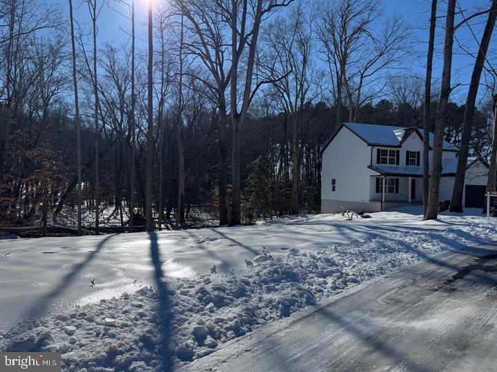 Charming home nestled in a winter wonderland.