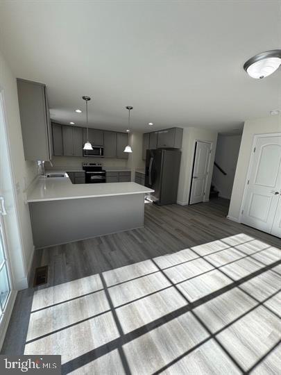 144 Pratts Branch Road Felton, DE 19943 - Photo 16 of 39 a large white kitchen with a sink and a stove top oven