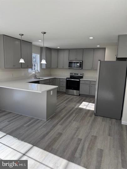 144 Pratts Branch Road Felton, DE 19943 - Photo 17 of 39 a kitchen with stainless steel appliances granite countertop a refrigerator a sink a stove and a oven