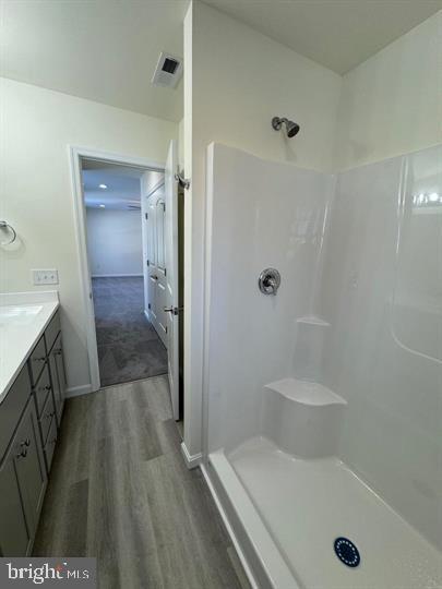 144 Pratts Branch Road Felton, DE 19943 - Photo 35 of 39 a bathroom with a tub a sink and glass door shower