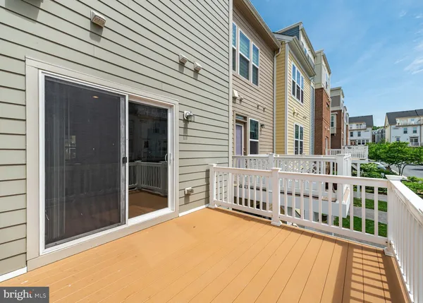 a view of a balcony with a barbeque