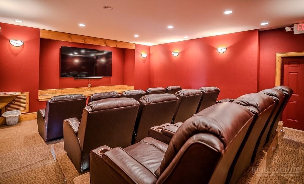 485 Woodlake Loop Road Elk Park, NC 28622 - Photo 37 of 44 a media room with lots of chairs and a projector