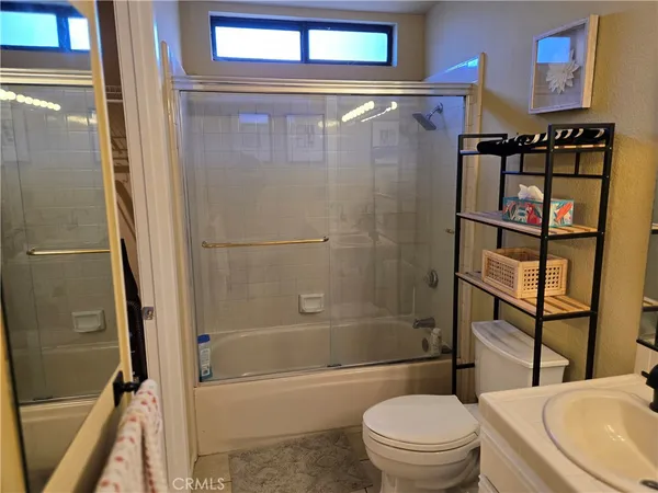 a bathroom with a bathtub toilet and a shower