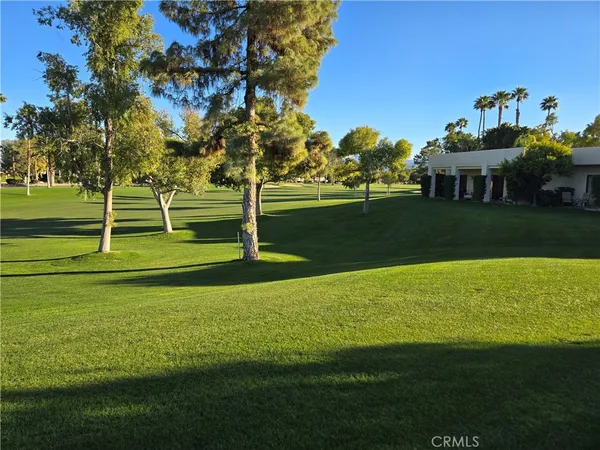 a view of a golf course with a lake