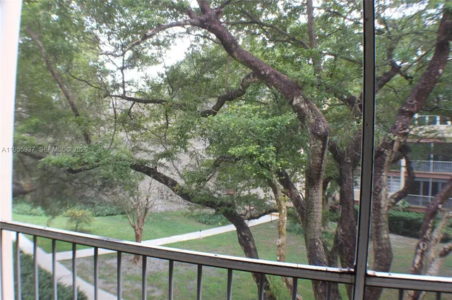 a view of a forest from a balcony