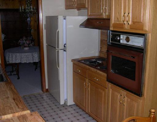 2246 Blue Ridge Springs Road Blue Ridge, VA 24064 - Photo 3 of 5 a kitchen with stainless steel appliances granite countertop a refrigerator and a stove
