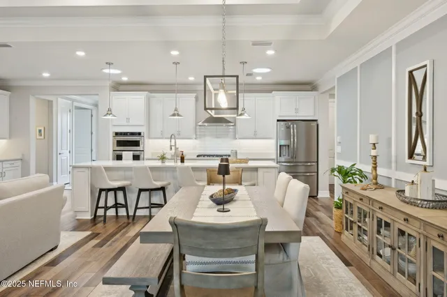 a kitchen with refrigerator and cabinets
