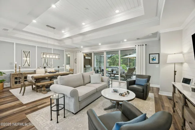 a large bathroom with a double vanity sink a large mirror and a shower