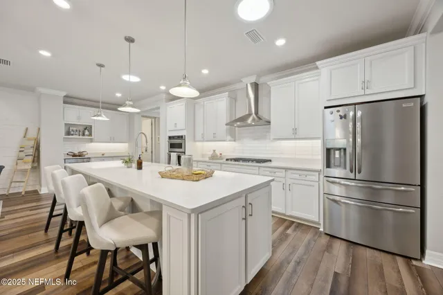 a living room with patio furniture and a flat screen tv