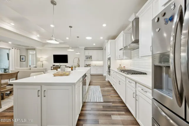 a view of a livingroom with furniture and a flat screen tv