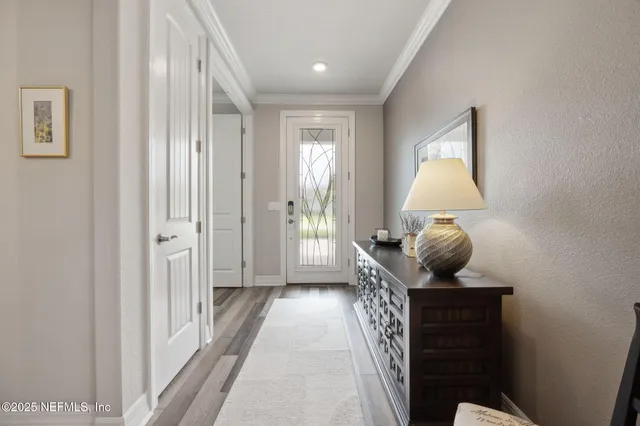 a bedroom with furniture and a flat screen tv