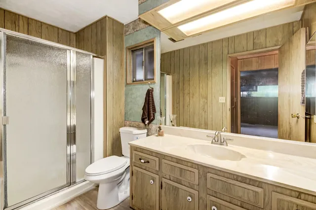 a bedroom with a bed and a mirror