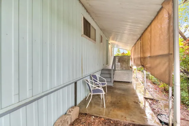 a front view of a house with a yard patio and fire pit