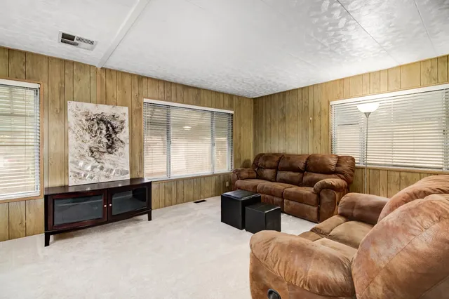 a living room with furniture and window
