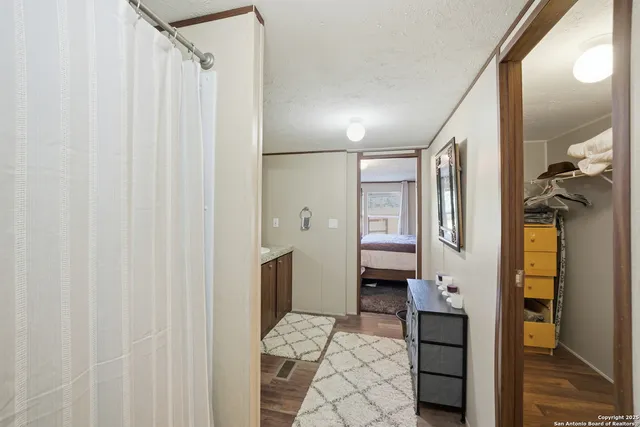 a bathroom with a shower and a sink