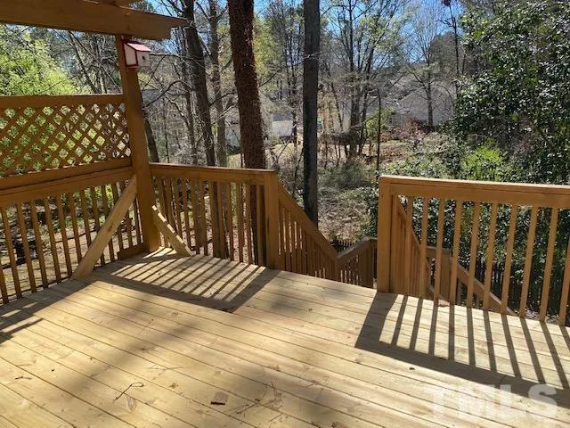 a view of wooden balcony and outdoor space